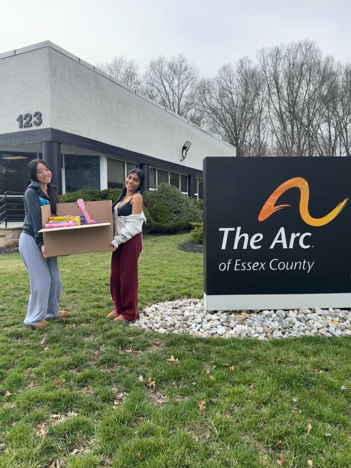 Volunteers delivering a donation box at The Arc of Essex County